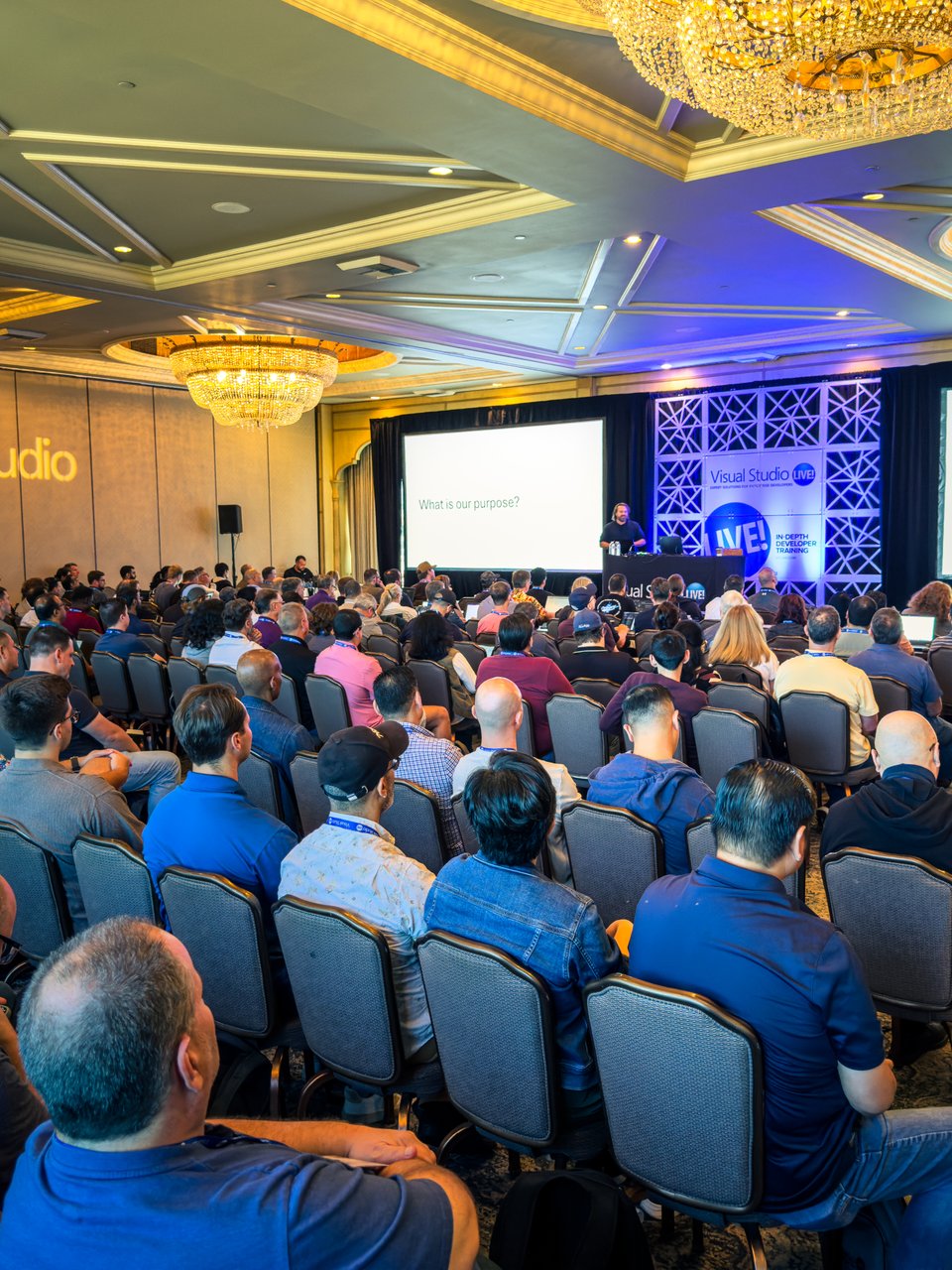 Eric Boyd speaking on stage at a conference